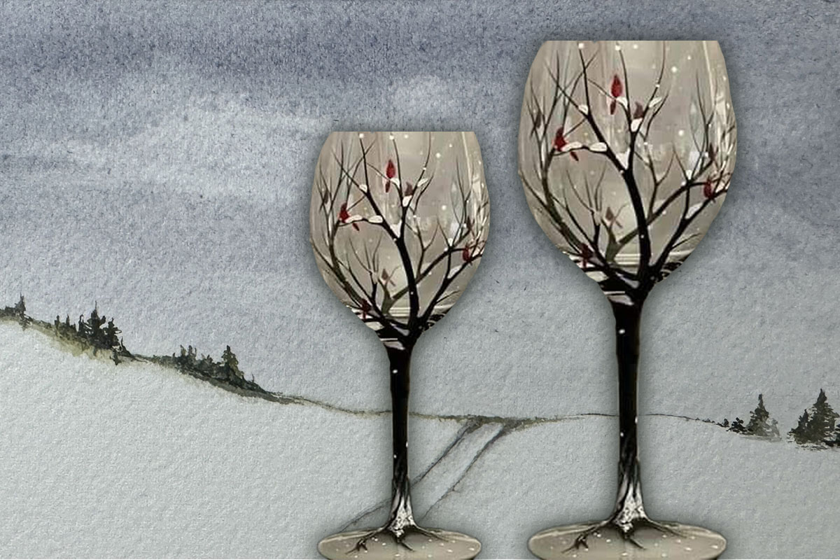 Two hand-painted wine glasses with a winter scene